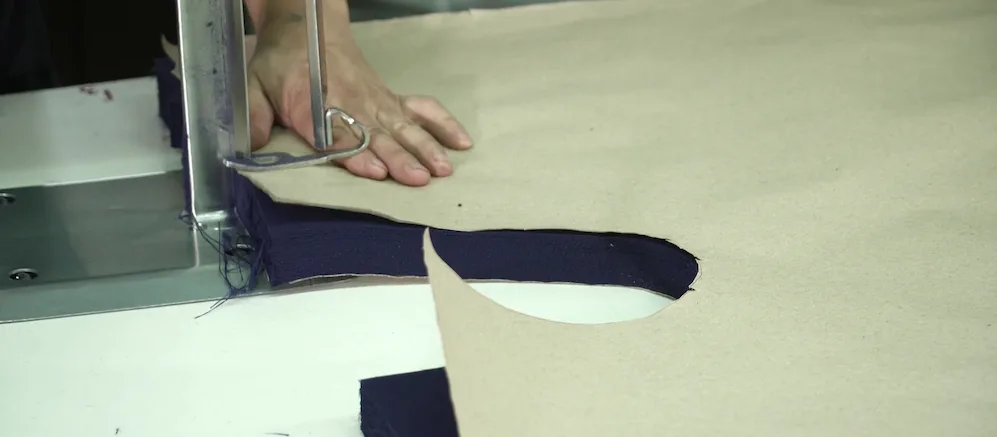 cutting fabric for production with a paper lay plan marker cutting fabric with marker